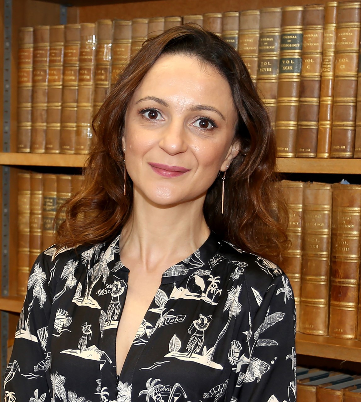 Formal headshot in the library